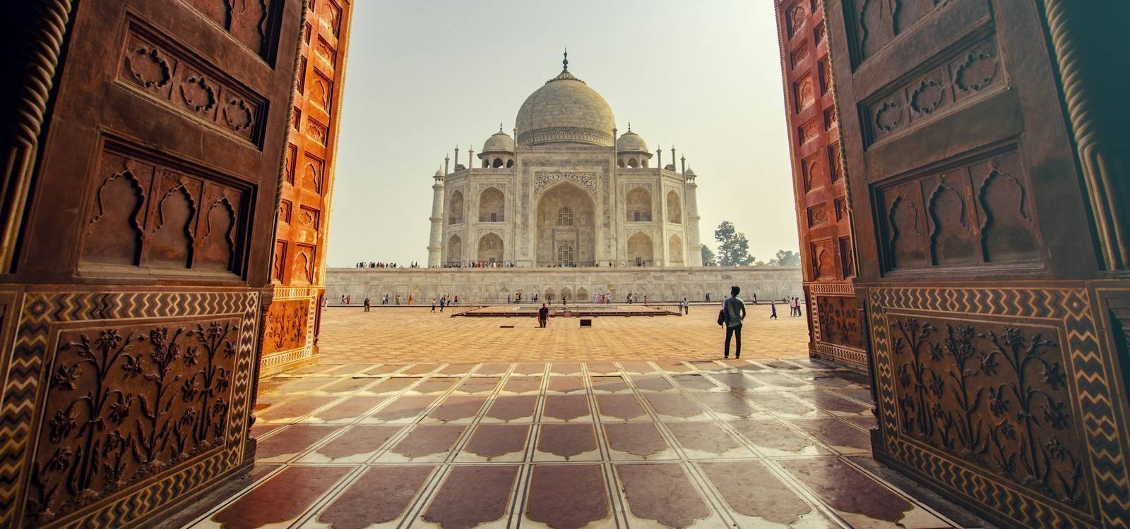 The Taj Mahal framed by a sandstone archway