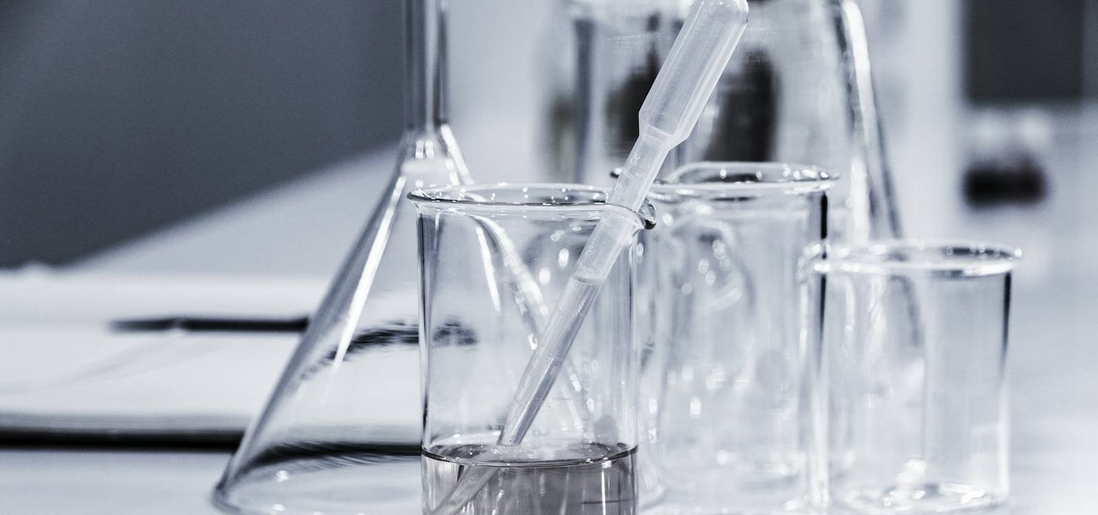 Laboratory glassware on a white bench