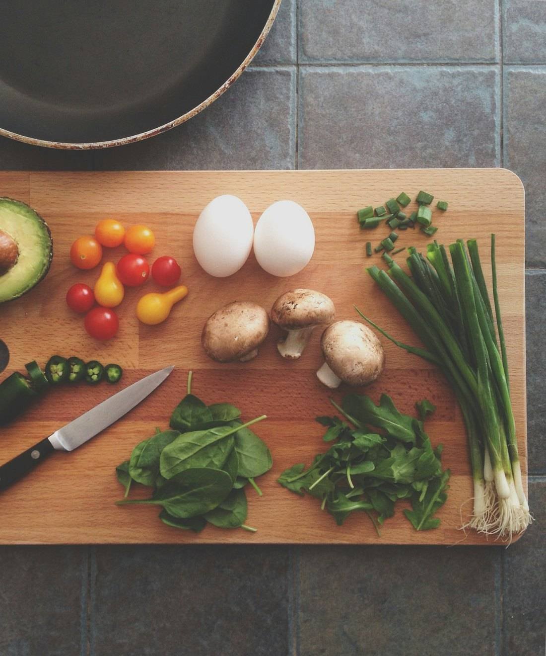 Fresh ingredients laid out on a wooden chopping board
